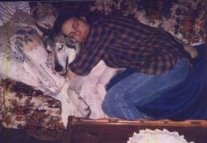 The author's mom and Damien on the couch.