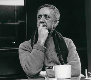 Richard F. Mason at his directing desk, a cup of coffee never far away.