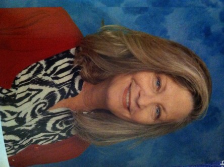 The author smiles for one last photo before retirement.