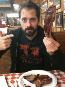 The author today, pictured with a plate of meat.
